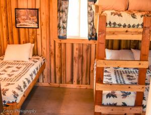 a room with two bunk beds and a window at Timber Wolf Resort in Hungry Horse +44 photos