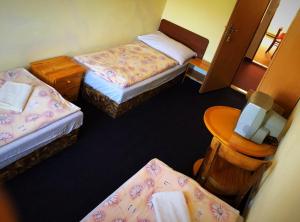 Postel nebo postele na pokoji v ubytování Penzion Na Prachárně