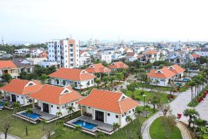 an aerial view of a residential neighborhood with houses at Ban Thach Riverside Hotel & Resort in Tam Ky