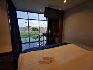 Postel nebo postele na pokoji v ubytování Skyline Resort