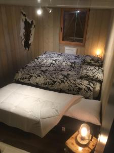 Postel nebo postele na pokoji v ubytování Chalet Le Cactus avec sauna privatif