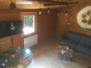 Posezení v ubytování Chalet Le Cactus avec sauna privatif