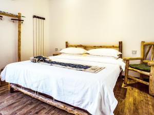 Cama o camas de una habitación en Dunhuang Silk Yododo Inn