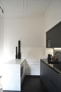 Kuchyňa alebo kuchynka v ubytovaní PALAZZO DELLE SIRENE Deluxe Apartment & Boutique Rooms + 23 fotografií