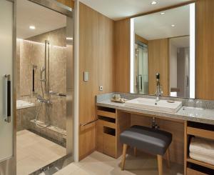 a bathroom with a sink and a shower at Keio Plaza Hotel Tokyo in Tokyo