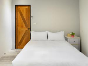 Letto o letti in una camera di Donggang Jingdi B&B