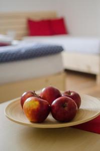 a plate of apples sitting on a table at Apartmany a Ubytovani Mlynice Litovel in Litovel