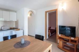 Kuchyň nebo kuchyňský kout v ubytování Apartmani Lana