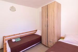 Postel nebo postele na pokoji v ubytování Apartmani Lana