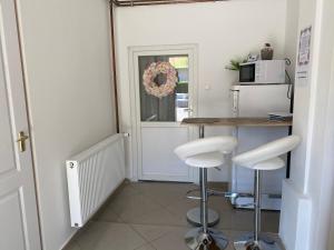 A kitchen or kitchenette at Virág Vendégház