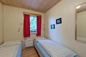 Postel nebo postele na pokoji v ubytování Trysil Motell & Vandrerhjem