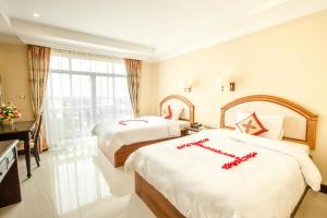 Rúm í herbergi á Classy Hotel & Spa