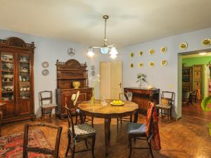 a kitchen and dining room with a table and chairs at Belvilla by OYO Monti in Senigallia