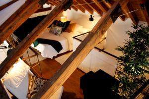 a view of a room with a bed in a attic at Ático dúplex en Centro Histórico Toledo in Toledo