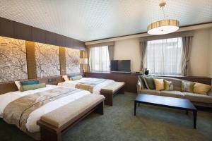 Katil atau katil-katil dalam bilik di Hotel Avalorm Kinokuni