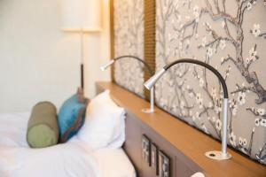 Katil atau katil-katil dalam bilik di Hotel Avalorm Kinokuni