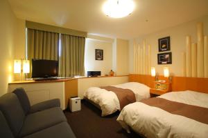 Katil atau katil-katil dalam bilik di Hotel Avalorm Kinokuni