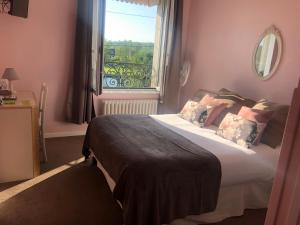 Postel nebo postele na pokoji v ubytování Hotel de L'Oise