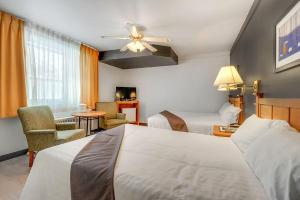Postel nebo postele na pokoji v ubytování Motel Lévis