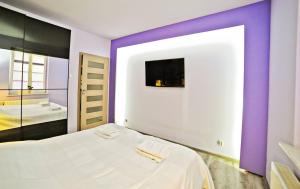 Tempat tidur dalam kamar di Grand Apartments - Malibu - Apartment located 5 minutes from the sea