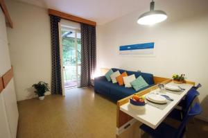 Гостиная зона в Residence Golfo Della Lacona