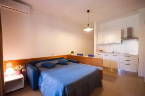 Кровать или кровати в номере Residence Golfo Della Lacona