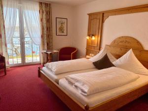 Postel nebo postele na pokoji v ubytování Seehotel Schäpfle