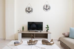 A television and/or entertainment centre at Villa Elaia Mare