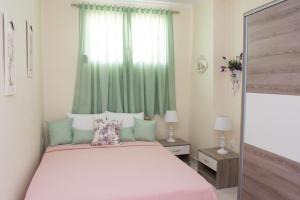A bed or beds in a room at Villa Elaia Mare