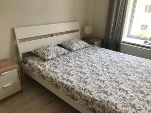 Cama ou camas em um quarto em Igo apartment Uzupis