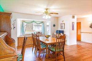 a dining room with a table and chairs at Linger Longer Lakeside Cottage in Oroville