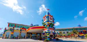 a building with a colorful tower in front of it at LEGOLAND California Hotel and Castle Hotel in Carlsbad