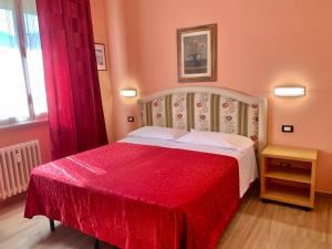 Postel nebo postele na pokoji v ubytování Albergo Cinzia