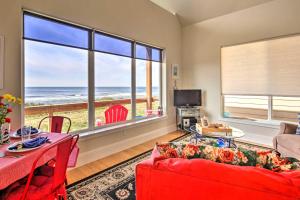 a living room with a view of the ocean at Oceanfront Cottage with Deck and Secluded Beach Access! in Yachats