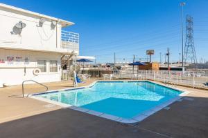 a swimming pool on the side of a building at Motel 6 Fort Worth, Tx - Stockyards in Fort Worth
