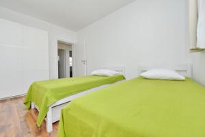 Posteľ alebo postele v izbe v ubytovaní Apartments Verita