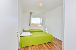 Posteľ alebo postele v izbe v ubytovaní Apartments Verita