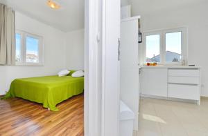 Posteľ alebo postele v izbe v ubytovaní Apartments Verita