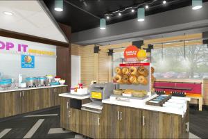 a fast food restaurant with donuts on display at Tru by Hilton Perrysburg Toledo in Rossford