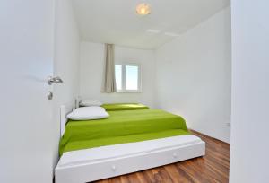 Posteľ alebo postele v izbe v ubytovaní Apartments Verita