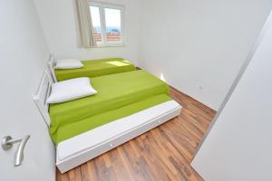 Posteľ alebo postele v izbe v ubytovaní Apartments Verita
