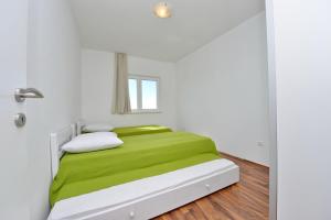 Posteľ alebo postele v izbe v ubytovaní Apartments Verita