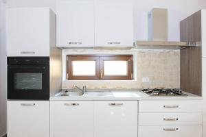 Kuchyňa alebo kuchynka v ubytovaní Dimora Mariù - Casa Vacanze