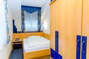 Voodi või voodid majutusasutuse Hotel Pendl toas