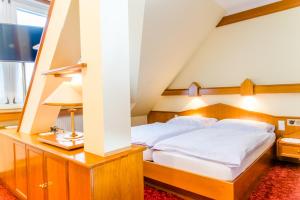 Voodi või voodid majutusasutuse Hotel Pendl toas