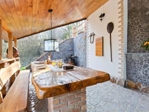 a kitchen with a large wooden table in a house at Rustic Holiday Home in Donja Stubica with Terrace in Donja Stubica