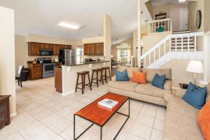 a living room with a couch and a table at Montana Villa WR001 in Davenport