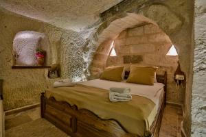 Postel nebo postele na pokoji v ubytování Hidden Cave Hotel