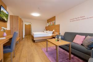 Ένα ή περισσότερα κρεβάτια σε δωμάτιο στο Gästehaus-Aparthotel Grabner