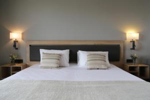 Postel nebo postele na pokoji v ubytování Palmyra Beach Hotel